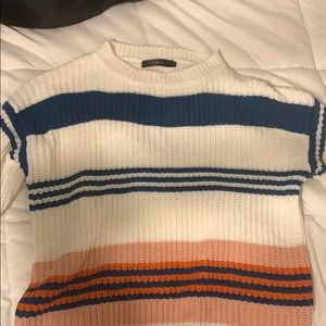 Pink,blue,red, and white sweater.